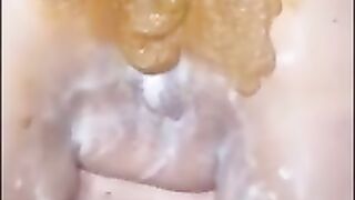 Brunette babe smears shit on her pussy and ass