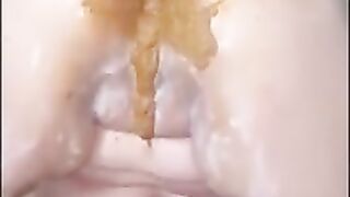 Brunette babe smears shit on her pussy and ass