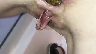 Girl pulls out a huge shit and holds it in her hand