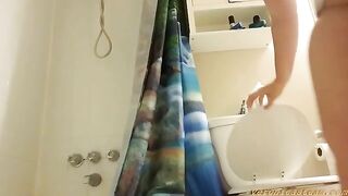 Woman sits on the toilet and shits while playing with her breasts