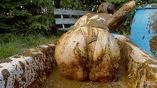 Woman covers her body in shit