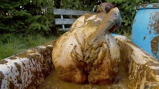 Woman covers her body in shit