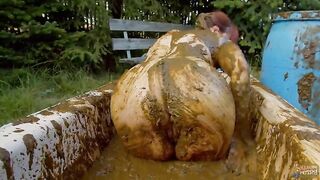 Woman covers her body in shit