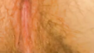 Hairy babe spreads her ass cheeks on the floor