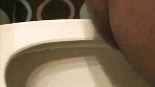Ebony girl pooping in the toilet