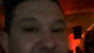 Woman pisses on the floor while eating a banana at the bar