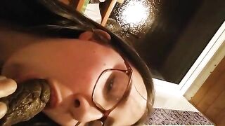 A woman takes a bite of cake with shit on top