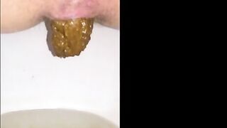 Woman shits a long piece of shit into a bowl
