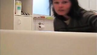 Woman takes a dump in the sink, face first