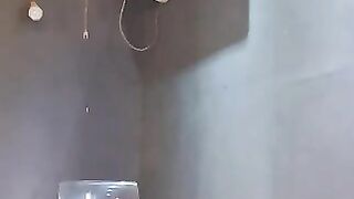 Asshole slut showers herself with her own piss
