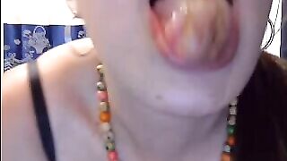 Woman with a necklace plays with shit on her fingers