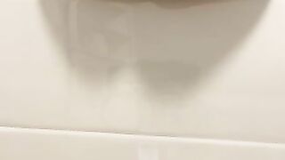 Pretty girl pisses on the toilet floor from above