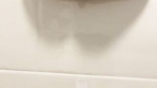 Pretty girl pisses on the toilet floor from above