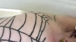 Woman with spiderweb tattoos takes a shit on her ass