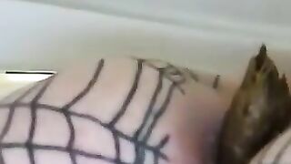 Woman gets her ass licked by a dog while wearing a fishnet thong