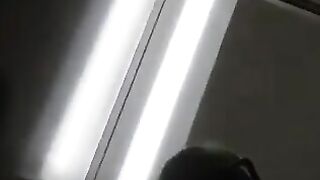 Man sticks his tongue out while wearing fishnet stockings