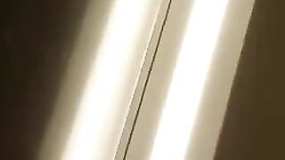 Man sticks his tongue out while wearing fishnet stockings