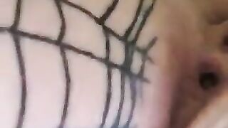 Girl gets her asshole pierced while wearing a fishnet body suit