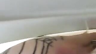 Girl in fishnet stockings spreads her ass cheeks and shits