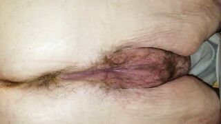 Pants down over toilet closeup