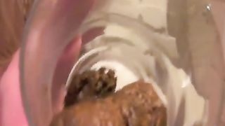 Girl Shits in Small Glass