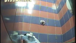 Blonde girl taking a shit in a public toilet