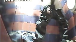 Blonde girl taking a shit in a public toilet