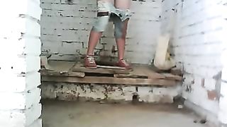 Girl pooping in a public wooden bath