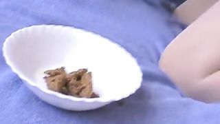 Smearing shit on her face