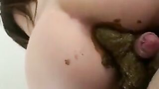 Slut pooping on the cock