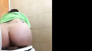 Tattooed babe shitting in the bathroom
