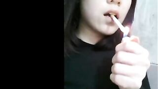 Cute smoking chick teasing and pooping