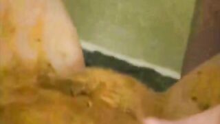 Nasty brunette milf rubbing shit on her tits