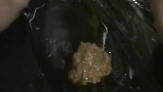 Smearing shit on her face and body