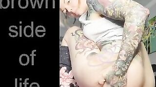 Curly tattooed babe pushing shit