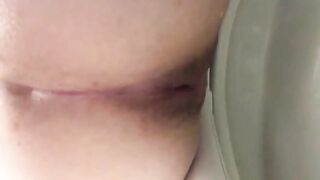 Dark turd stuck closeup