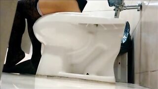 Under the stall in the toilet