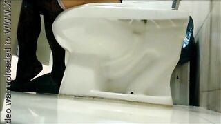 Under the stall in the toilet