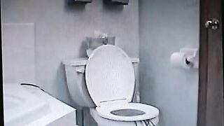Vintage video of a brunette milf shitting