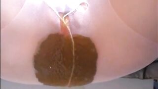 Woman shitting a big diarrhea on her white pantyhose