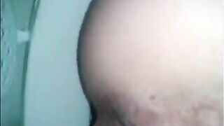 Woman shitting in the toilet real closeup