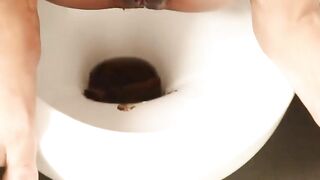Asian chick takes slow poo into bowl