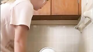 Babe squats backwards on Toilet