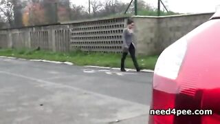 Blonde Peeing In A Supermarket Parking Lot