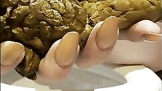 Chubby gal shits into her hand over the toilet