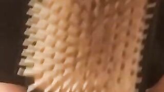 Ellis brushing then squirtin in the tub
