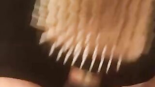 Ellis brushing then squirtin in the tub