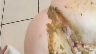 Filthy slut shitting on her own face and smearing that shit over