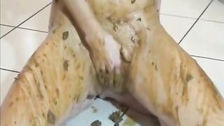 Filthy slut shitting on her own face and smearing that shit over