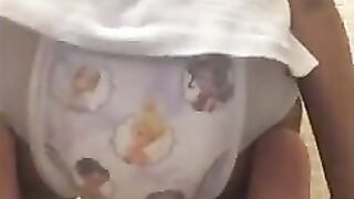 Girl messes her pullup diaper